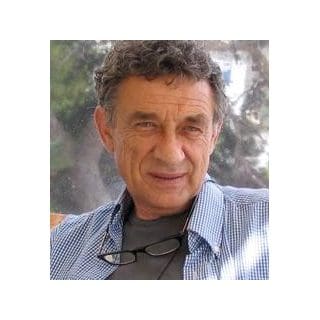 Man in checkered shirt with glasses.