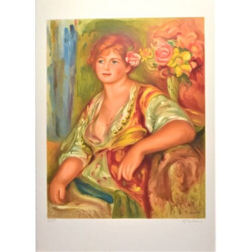 Seated woman in colorful attire, flowers present.