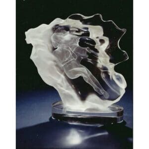 Abstract glass sculpture on a dark background.