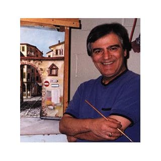 Man smiling with painting of street scene.