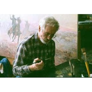 Artist painting with brushes in studio.