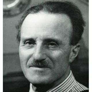 Older man with mustache and striped shirt.