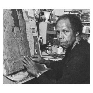 Artist working on a sculpture in studio.