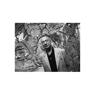 Man standing in front of abstract mural.
