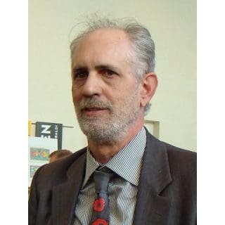 Man in suit with patterned tie.