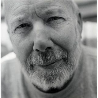 Elderly man with a thoughtful expression.
