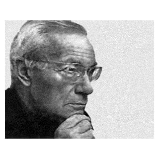 Elderly man with glasses, thoughtful expression.