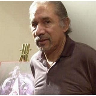 Man standing beside an easel with painting.