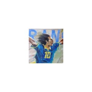 Soccer player celebrating a goal with arms raised.