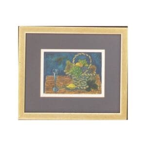 Framed artwork depicting a basket of fruits and a glass on a table.