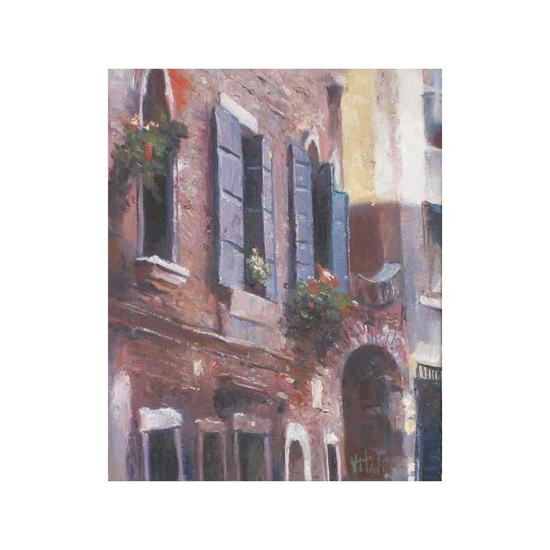 A charming rustic building with wooden shutters and flower boxes.