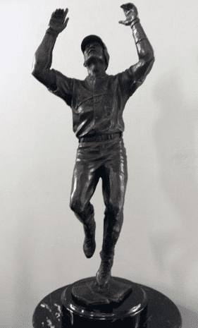 A person jumping in mid-air wearing casual clothes.